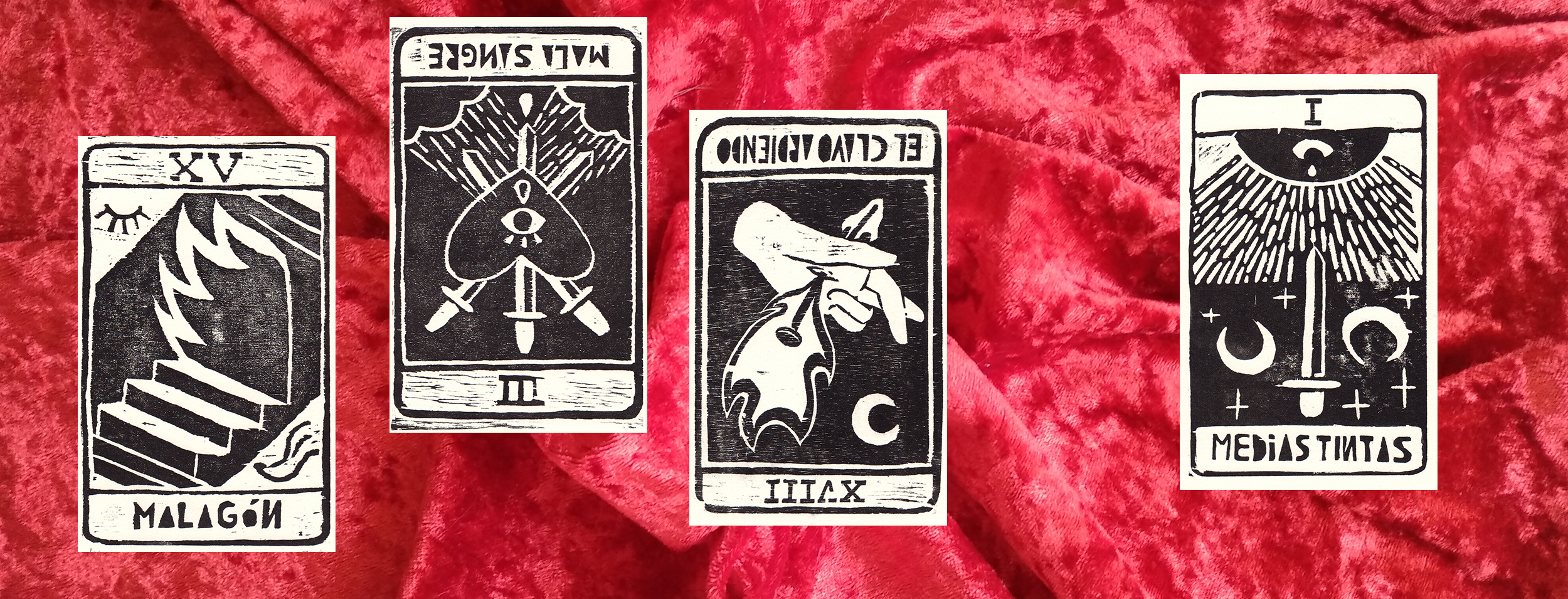 Four tarot cards (major arcana fifteen, reversed three of swords, reversed major arcana eighteen, ace of swords) over a red velvet background